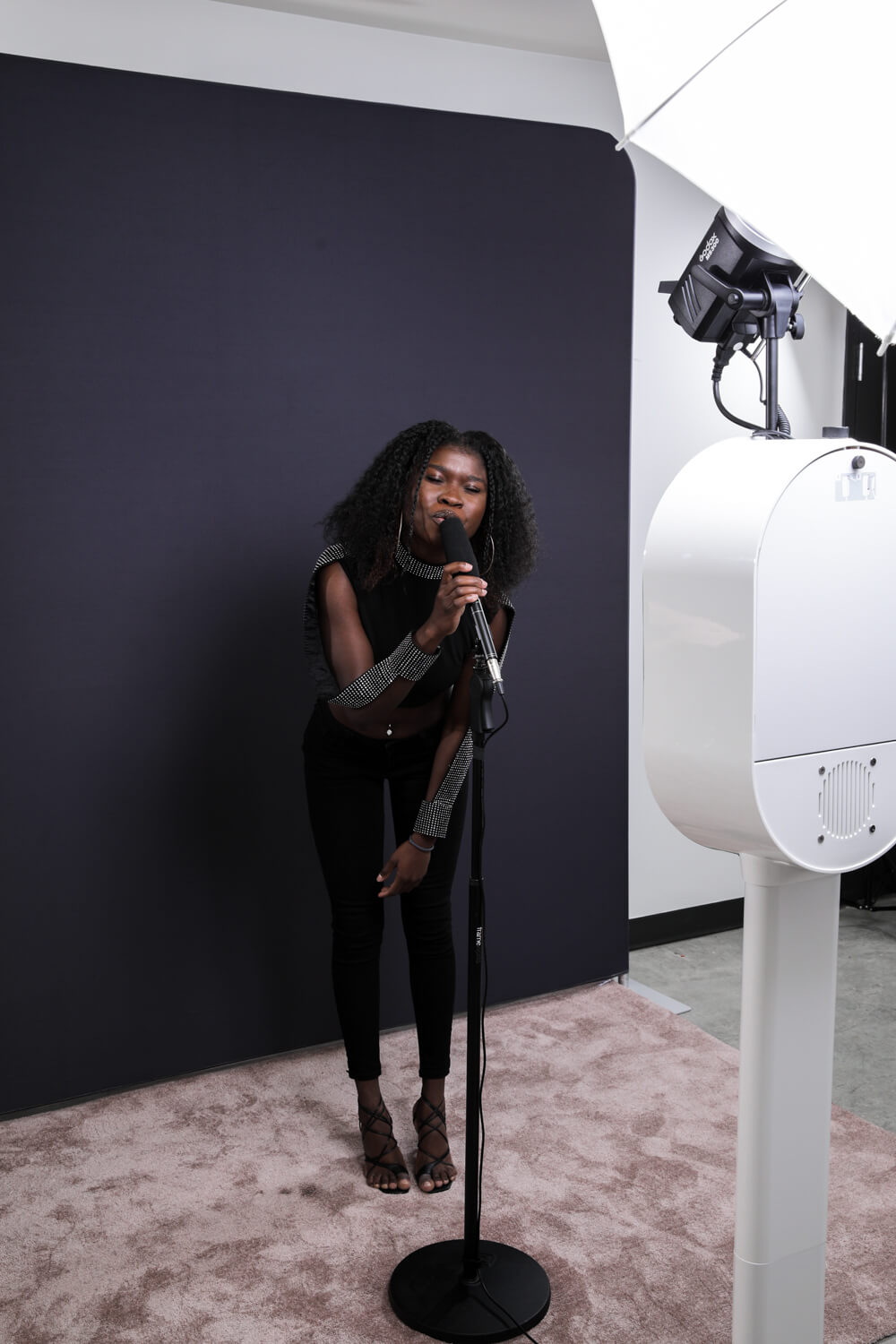 Video Confessional — guest singing into mic